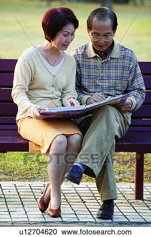 Casual Clothing, Brown Hair, Asian Ethnicity, Mature Couple, Pants, Button Down Shirt View Large Photo Image Stock Image - Casual Clothing, Brown Hair, Asian Ethnicity, Mature Couple, Pants, Button Down Shirt. Fotosearch