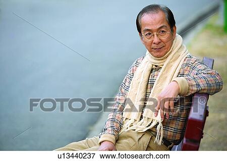 Close-Up, Bench, Casual Clothing, Button Down Shirt, Black Hair, Asian Ethnicity View Large Photo Image Stock Photo - Close-Up, Bench, Casual Clothing, Button Down Shirt, Black Hair, Asian Ethnicity. Fotosearch