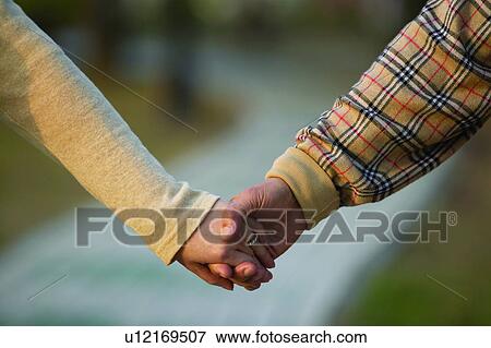 Close-Up, Day, Focus On Foreground, Golden Years, Holding Hands View Large Photo Image Stock Photo - Close-Up, Day, Focus On Foreground, Golden Years, Holding Hands. Fotosearch