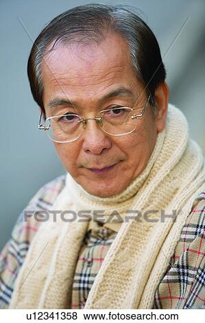 Close-Up, Serious, Scarf, Eyeglasses, Individuality View Large Photo Image Stock Photo - Close-Up, Serious, Scarf, Eyeglasses, Individuality. Fotosearch