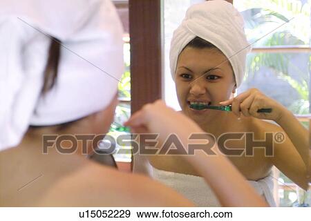 Stock Photo - Bathroom, Close-Up, Brushing Teeth, Body Care, Asian Ethnicity. Fotosearch