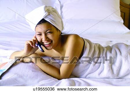 Stock Photograph - Bed, Bedroom, Asian Ethnicity. Fotosearch