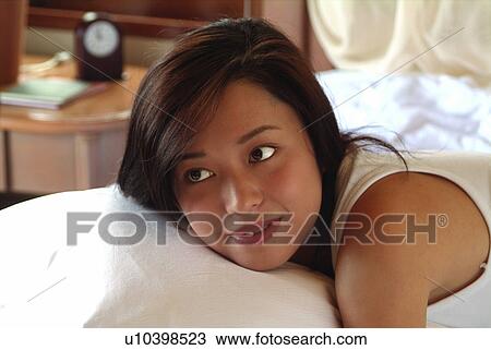 Stock Image - Bedroom, Close-Up, Brown Hair, Asian Ethnicity. Fotosearch