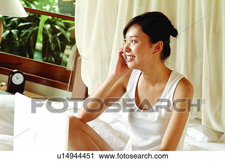 Bedroom, Indoor, One Person, One Young Woman Only, Curtain, Communication, On The Phone View Large Photo Image Stock Image - Bedroom, Indoor, One Person, One Young Woman Only, Curtain, Communication, On The Phone. Fotosearch
