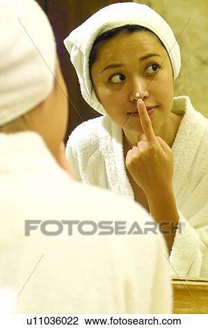 Stock Image - Body Care, Touching, Bathrobe, Asian Ethnicity, Human Nose, Waist-Up. Fotosearch