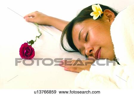 Stock Photo - Close-Up, Bathrobe, Brown Hair, Bedroom, Bed, Asian Ethnicity. Fotosearch