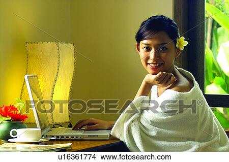 Hand On Chin, Working At Home, Wearing Flowers, Bathrobe View Large Photo Image Picture - Hand On Chin, Working At Home, Wearing Flowers, Bathrobe. Fotosearch