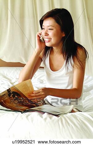 Happiness, Communication, Young Adult, Toothy Smile, On The Phone View Large Photo Image Stock Image - Happiness, Communication, Young Adult, Toothy Smile, On The Phone. Fotosearch