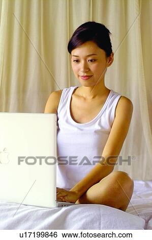 One Young Woman Only, Laptop, Curtain, Home Truths, Lifestyles, Using Laptop, Young Adult View Large Photo Image Stock Photograph - One Young Woman Only, Laptop, Curtain, Home Truths, Lifestyles, Using Laptop, Young Adult. Fotosearch