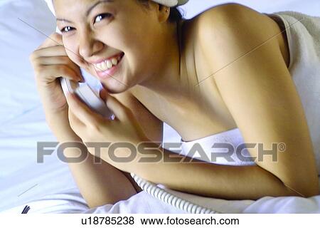 Wrapped In A Towel, Landline Phone, On The Phone, Happiness, Holding, Communication View Large Photo Image Stock Photo - Wrapped In A Towel, Landline Phone, On The Phone, Happiness, Holding, Communication. Fotosearch