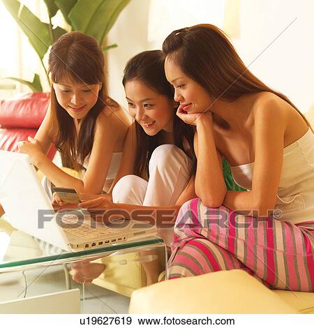 Stock Photo - Asian Ethnicity, Casual Clothing, Brown Hair, Adults Only. Fotosearch