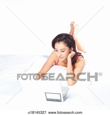 Stock Photo - Barefoot, Black Hair, Casual Clothing. Fotosearch