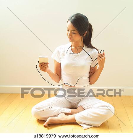 Stock Photo - Barefoot, Casual Clothing, Black Hair, Asian Ethnicity. Fotosearch