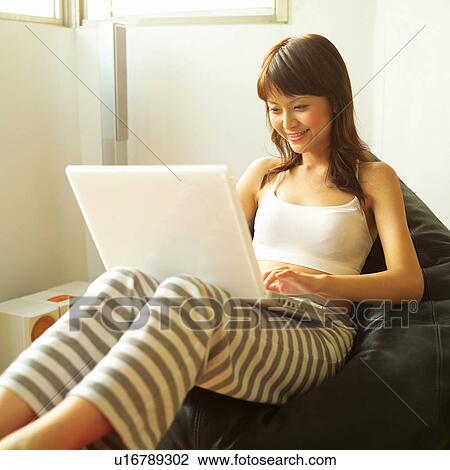 Stock Image - Brown Hair, Casual Clothing, Asian Ethnicity. Fotosearch