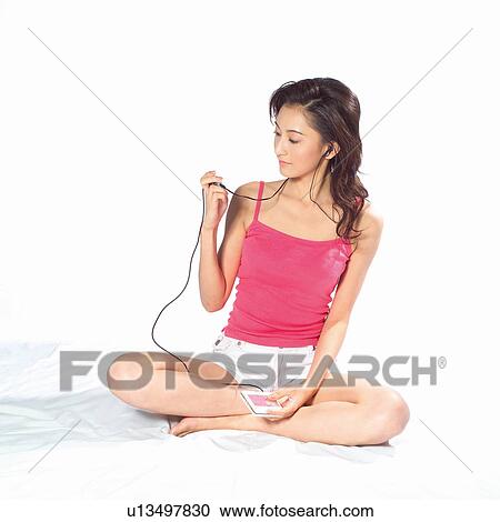 Stock Image - Casual Clothing, Carefree, Cross-Legged. Fotosearch