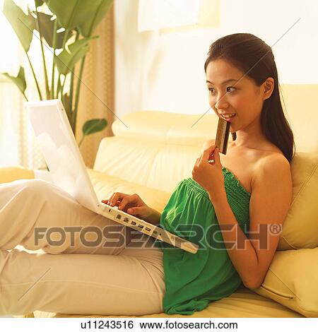 Casual Clothing, Finance, Woman, Home Interior, Accessibility, Long Hair View Large Photo Image Stock Photograph - Casual Clothing, Finance, Woman, Home Interior, Accessibility, Long Hair. Fotosearch