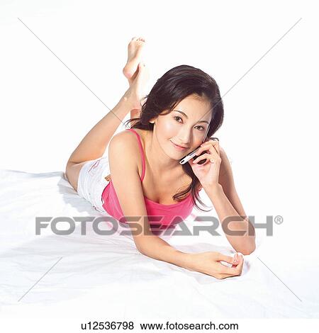 Stock Photo - Casual Clothing, One Young Woman Only, Indoor, Square, Day. Fotosearch