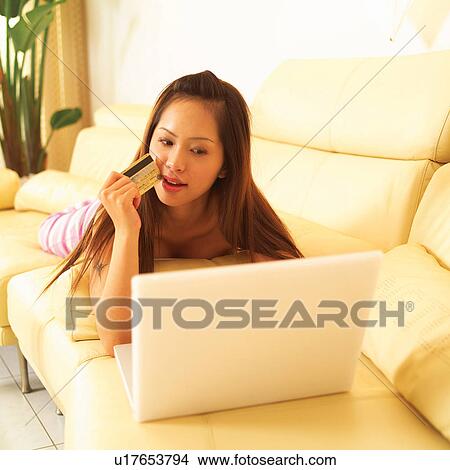Picture - Credit Card, Potted Plant, Mobility, Three-Quarter Length, Holding, Lifestyles, Couch. Fotosearch