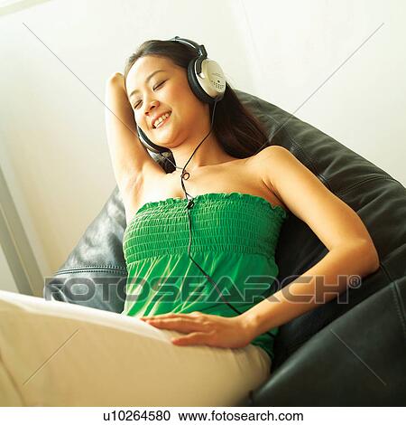 Tilt, Hands Behind Head, Woman, Listening, Entertainment View Large Photo Image Stock Image - Tilt, Hands Behind Head, Woman, Listening, Entertainment. Fotosearch