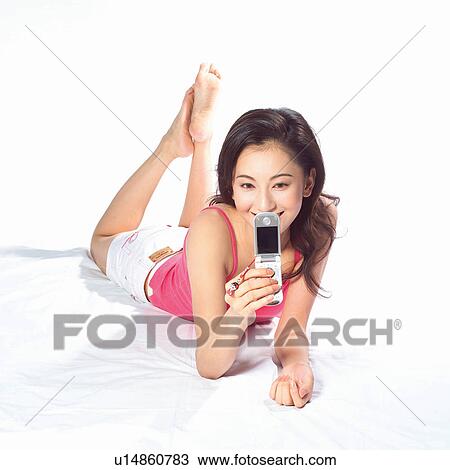 Stock Image - White Background, Square, Day, Indoor, Young Adult. Fotosearch