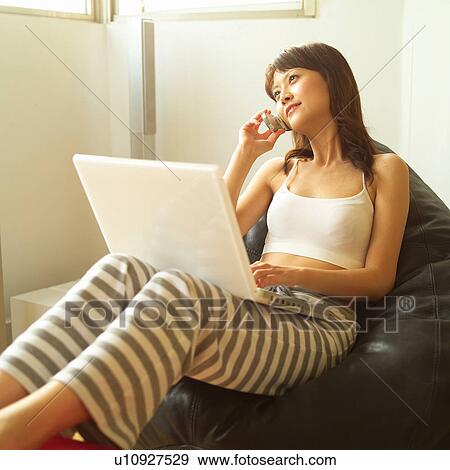 Young Adult, Holding, Laptop, Talking, Brown Hair, Top View Large Photo Image Stock Photo - Young Adult, Holding, Laptop, Talking, Brown Hair, Top. Fotosearch