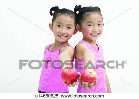 Stock Photography - Back To Back, Healthy Lifestyle, Asian Ethnicity, Indoor, Black Hair, Cut Out. Fotosearch