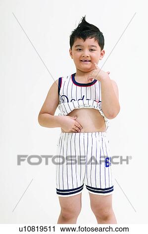 Stock Image - Black Hair, Human Teeth, Child, One Boy Only, Casual Clothing, Smiling. Fotosearch