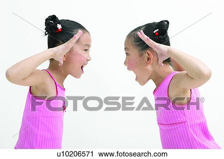 Stock Image - Black Hair, Two People, Pigtails, Cheerful, Indoor, Happiness, Waist-Up. Fotosearch