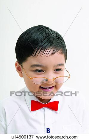 Stock Photo - Bow Tie, Innocence, Kids Stuff, Child, Human Teeth. Fotosearch