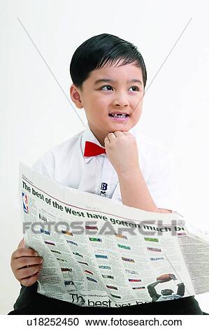 Stock Image - Casual Clothing, Asian Ethnicity, Button Down Shirt, Bow Tie, Black Hair, Child, 4-5 Years. Fotosearch