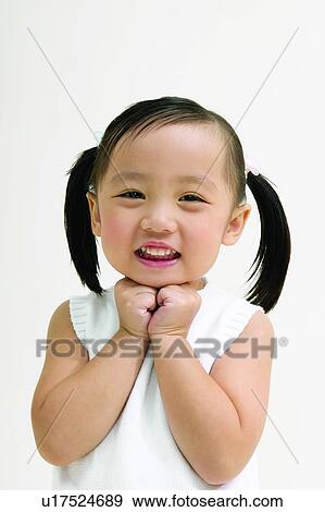 Stock Photo - Casual Clothing, White Background, Portrait, Happiness, Smiling. Fotosearch