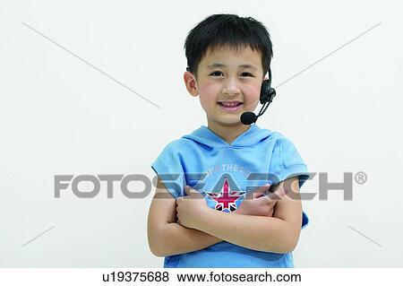 Stock Photo - Child, Arms Crossed, Casual Clothing, Black Hair, Asian Ethnicity, Clipping Path, 4-5 Years. Fotosearch