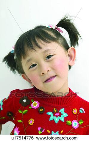 Stock Photograph - Child, Asian Ethnicity, Casual Clothing, Brown Hair, Bangs, Close-Up, 4-5 Years. Fotosearch