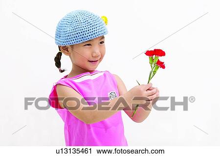 Stock Image - Cut Out, Close-Up, One Child Only, One Girl Only, Flower, Holding, Child. Fotosearch