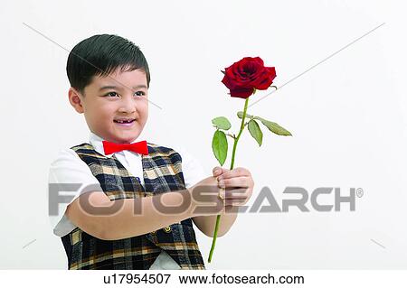 Stock Photo - Flower, Smiling, Looking Away, One Child Only, Indoor. Fotosearch