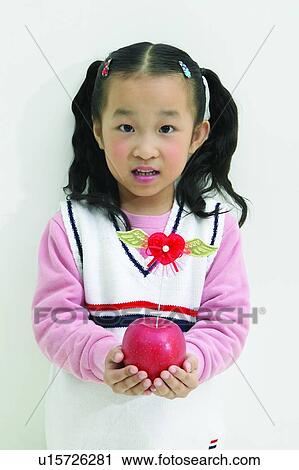 Happiness, Close-Up, One Girl Only, Looking At Camera, Portrait, Apple View Large Photo Image Stock Image - Happiness, Close-Up, One Girl Only, Looking At Camera, Portrait, Apple. Fotosearch