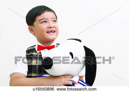 Stock Photograph - Head And Shoulders, Clipping Path, One Boy Only, Close-Up, Bow Tie, Toy, Asian Ethnicity. Fotosearch