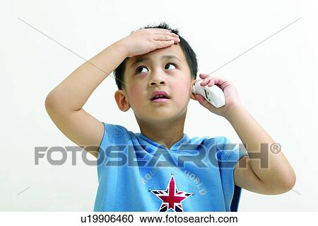 Stock Image - Healthcare And Medicine, Hooded Shirt, Digital Thermometer, Head And Shoulders, Asian Ethnicity, One Boy Only. Fotosearch