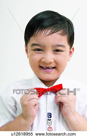 Stock Photography - Indoor, Innocence, Cut Out, Clipping Path, One Child Only, Looking At Camera. Fotosearch