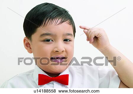 Innocence, Black Hair, Human Hand, Sitting, Portrait, Indoor, Smiling View Large Photo Image Stock Photo - Innocence, Black Hair, Human Hand, Sitting, Portrait, Indoor, Smiling. Fotosearch