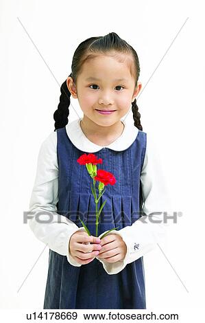 Stock Photo - Kids Stuff, Flower, Looking At Camera, One Person. Fotosearch