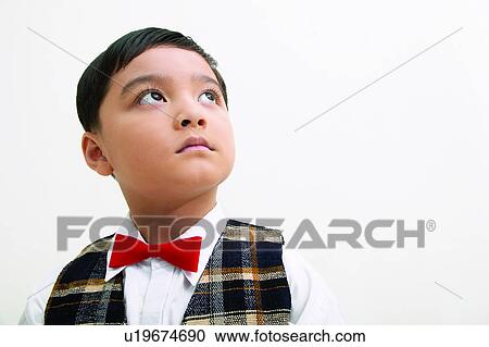 Stock Image - One Person, Childhood, Formal Clothing, Black Hair, Close-Up, Indoor, Kids Stuff. Fotosearch