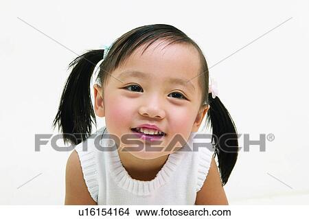 Picture - Smiling, One Child Only, Pigtails, Childhood, Toothy Smile, Asian Ethnicity. Fotosearch