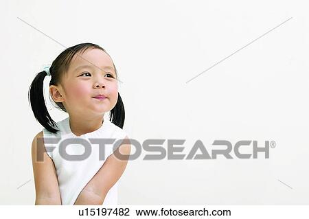 Smirking, Happiness, Childhood, One Girl Only View Large Photo Image Stock Image - Smirking, Happiness, Childhood, One Girl Only. Fotosearch