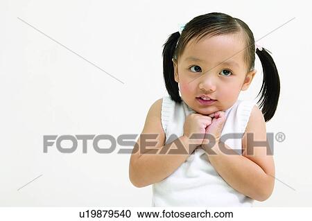 White Background, Asian Ethnicity, One Girl Only, Black Hair, Child, Hand On Chin View Large Photo Image Stock Image - White Background, Asian Ethnicity, One Girl Only, Black Hair, Child, Hand On Chin. Fotosearch