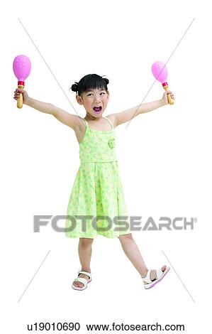 Stock Image - Casual Clothing, One Girl Only, Frock, Portrait, Black Hair, Holding. Fotosearch