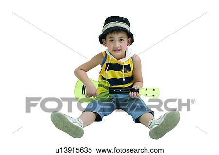 Stock Photography - East, Entertainment, Kids Stuff, Enjoyment, Guitar, Casual Clothing. Fotosearch