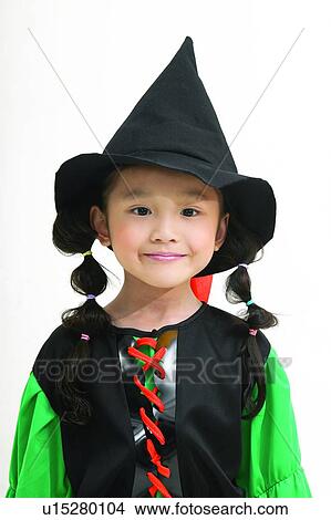 Indoor, Smiling, Hat, Pigtails, Traditional Culture, Witch's Hat, One Child Only View Large Photo Image Picture - Indoor, Smiling, Hat, Pigtails, Traditional Culture, Witch's Hat, One Child Only. Fotosearch