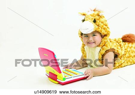 Looking At Camera, Waist-Up, Clipping Path, Smiling, Lying Down, Eastern, Kids Style View Large Photo Image Stock Photo - Looking At Camera, Waist-Up, Clipping Path, Smiling, Lying Down, Eastern, Kids Style. Fotosearch