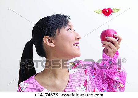 Stock Photograph - Black Hair, Looking Sideways, Healthy Eating, Girl, Head And Shoulders, Asian Ethnicity. Fotosearch